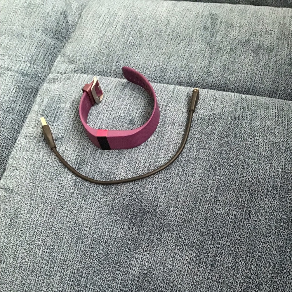 Purple FitBit with charger